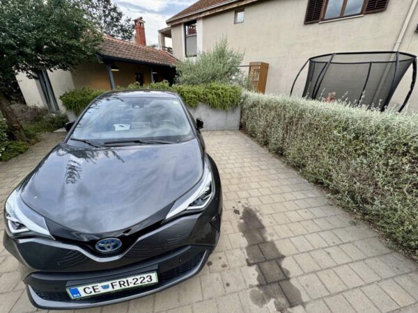 Black Toyota In Driveway