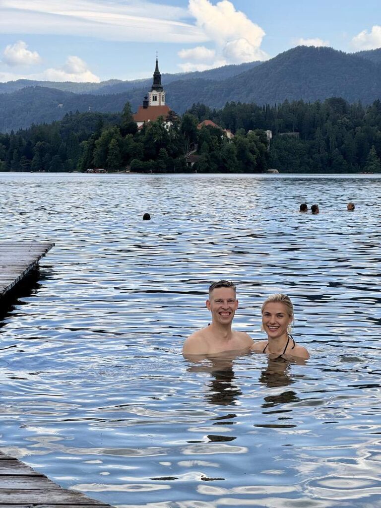 Couple Swimming In Lake Bled