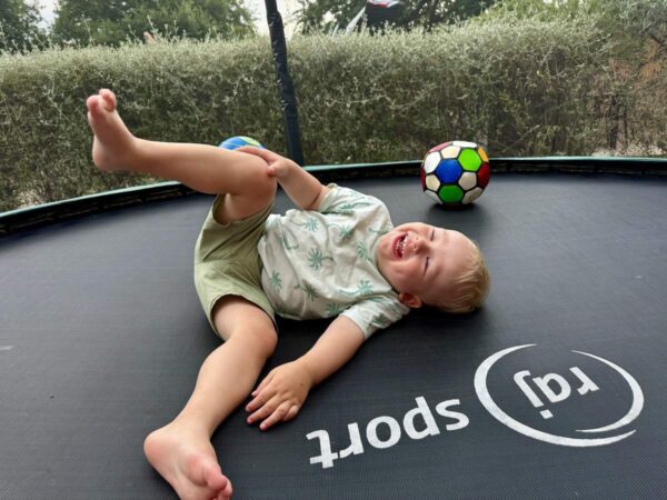 Happy Child On Trampoline