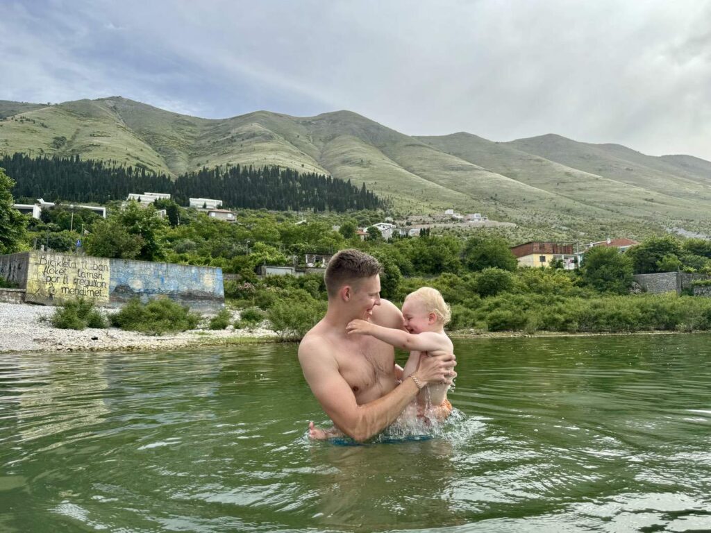 Father And Child Swimming In Lake in Skoder Albania